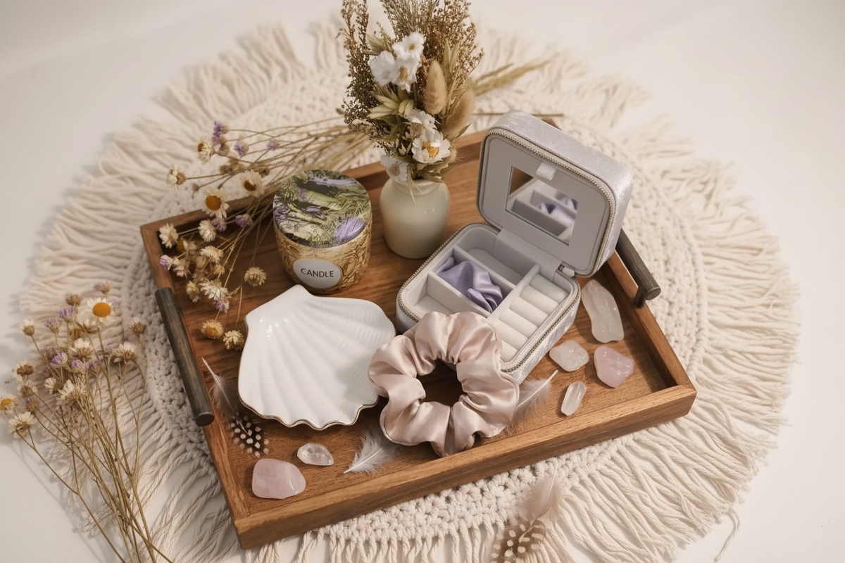 Overhead view of the boho vanity decor set with a velvet jewelry box, shell dish, candle, scrunchie and wood tray